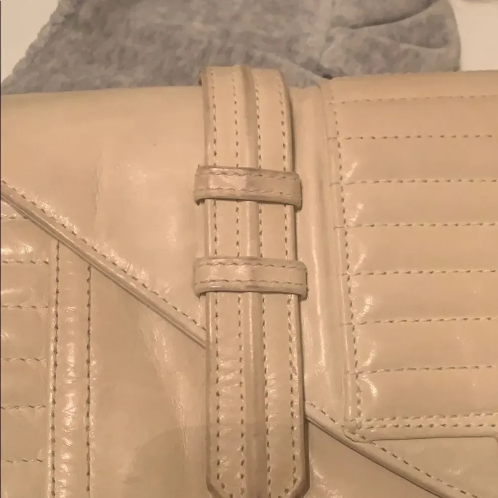 Reece Hudson cream colored clutch‎